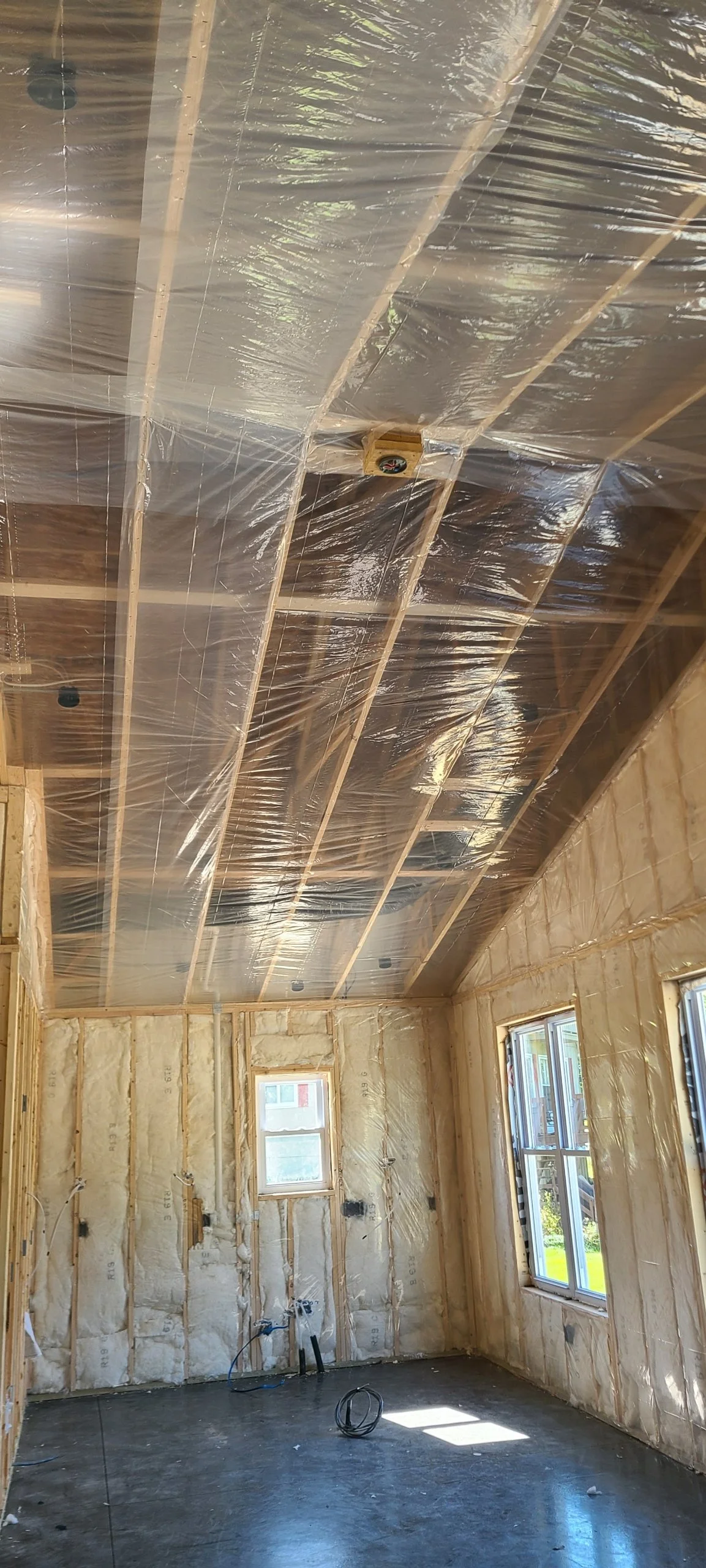 Fiberglass batting in the walls and the vapor barrier on the ceiling for drywall