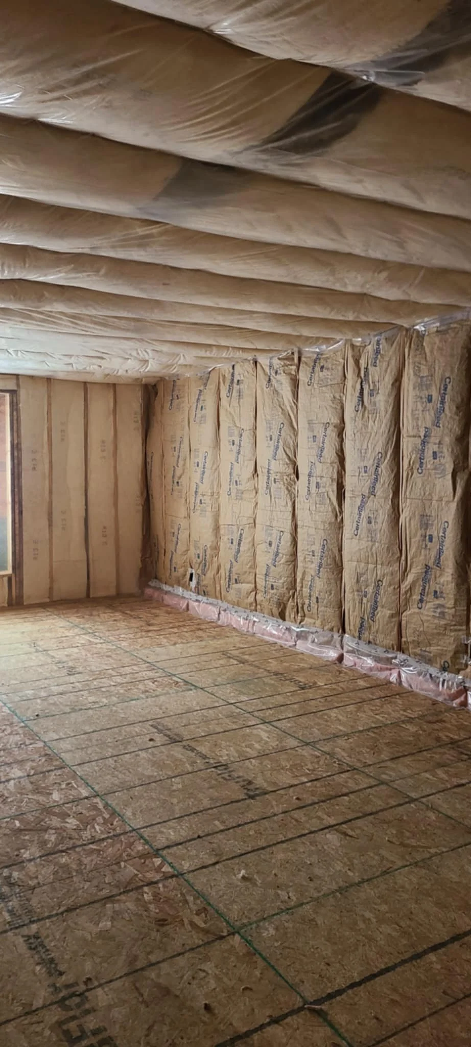 Fiberglass batting in bonus room sidewalls and ceiling