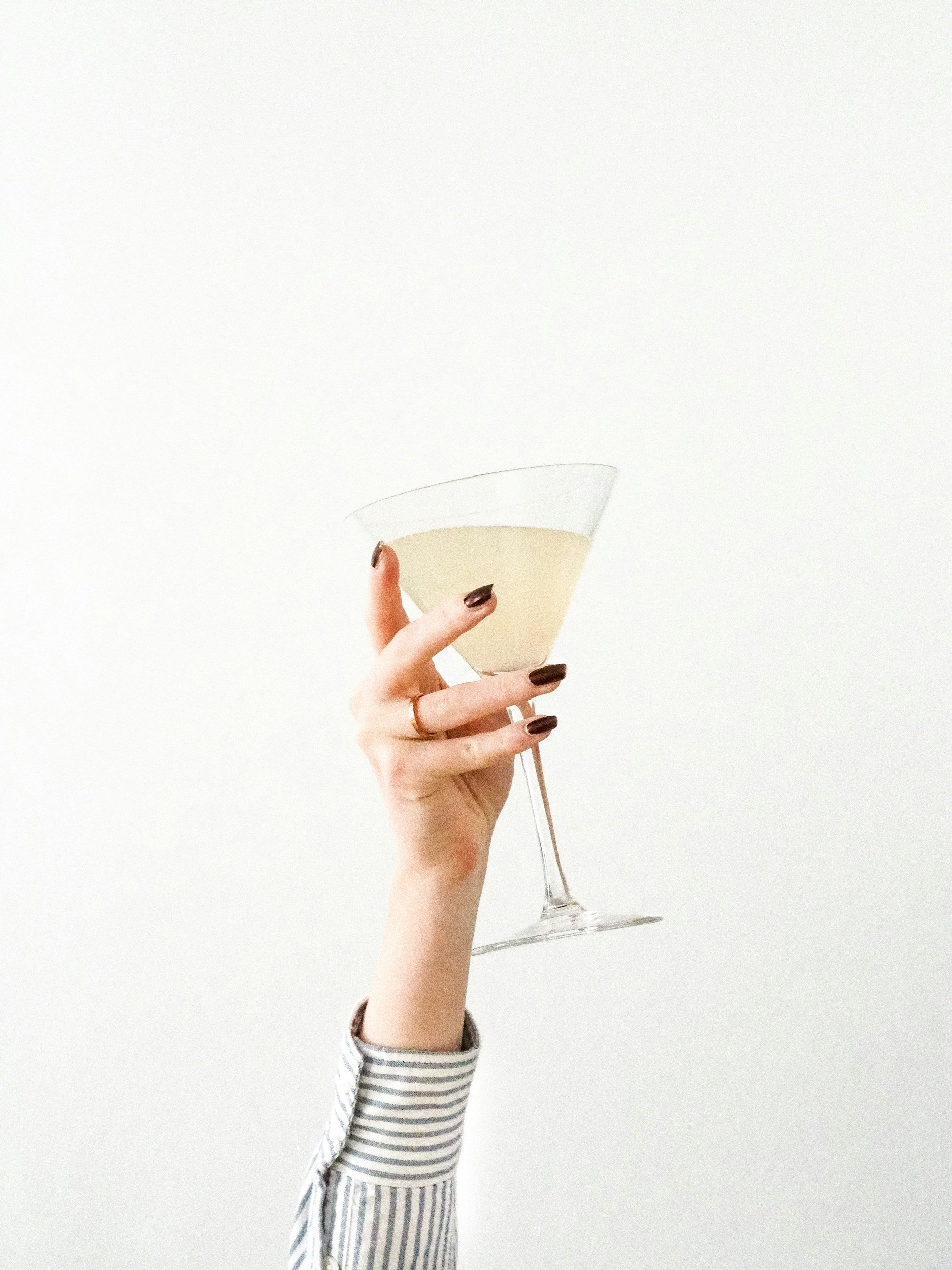 hand holding a martini