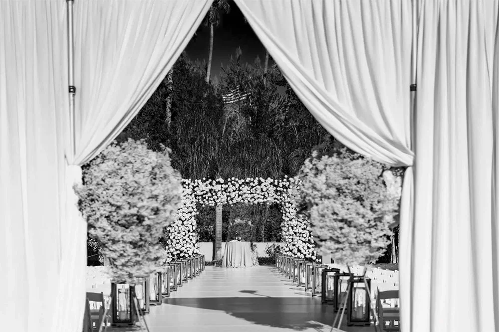 An aisle is more than a path.⁠
It's the last few steps before everything changes.⁠
Florals on either side.⁠
Light falling exactly where it should.⁠
Every step deserves a setting worthy of the moment.⁠