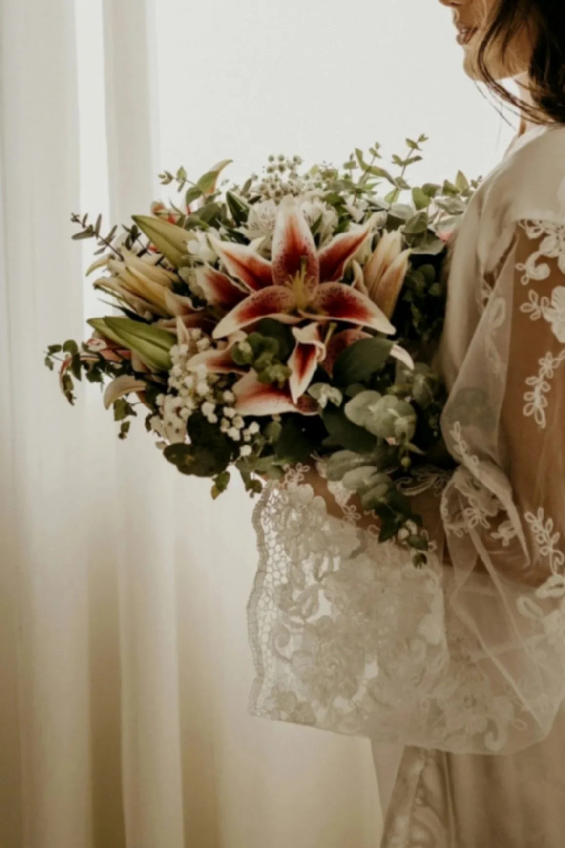 bride holding flowers