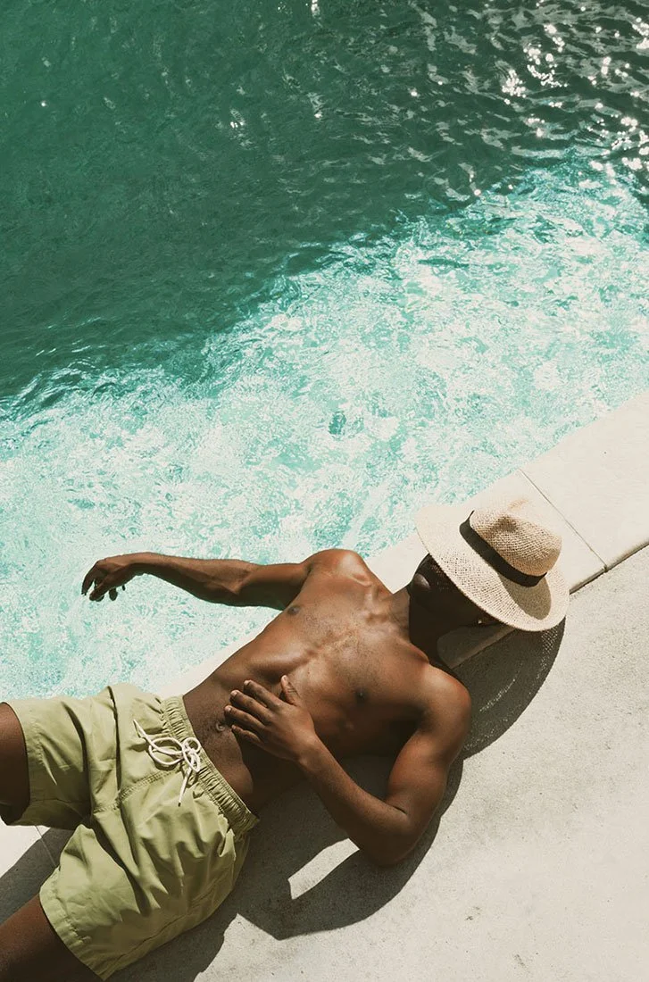man laying at the THUME pool