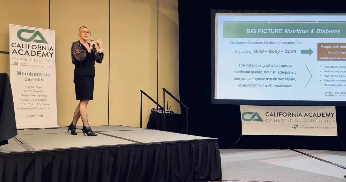 A speaker is presenting at a California Academy of Nutrition & Dietetics event. The presentation slide discusses the link between nutrition and diabetes, mentioning the impact on mind, body, and spirit, and the goal of reducing insulin resistance. A