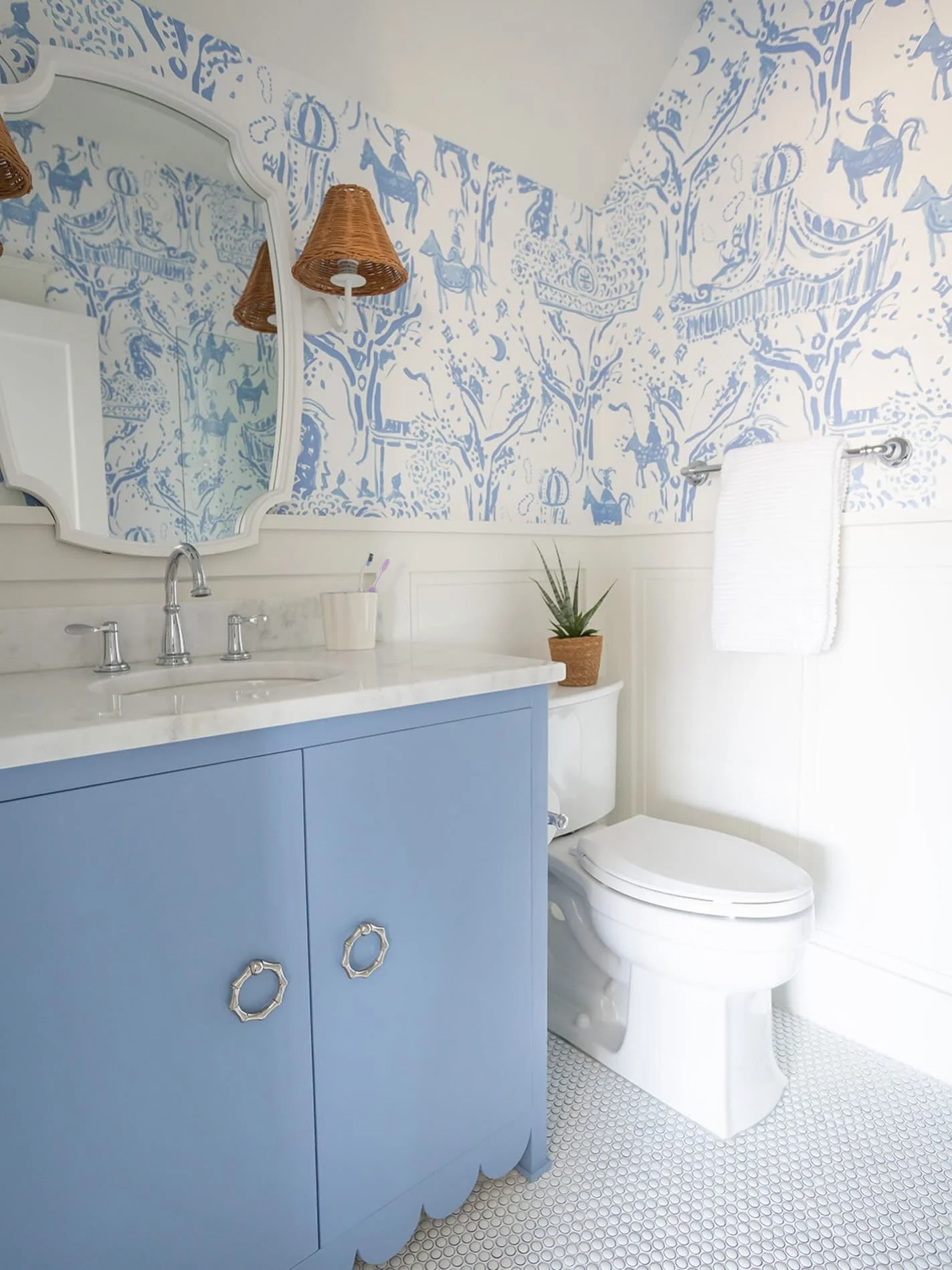 A playful bathroom now&hellip; but designed to grow beautifully with her for years to come. 💙

From the whimsical carnival-inspired wallpaper to the custom scalloped vanity and timeless glazed ceramic penny tile, every detail brings personality with