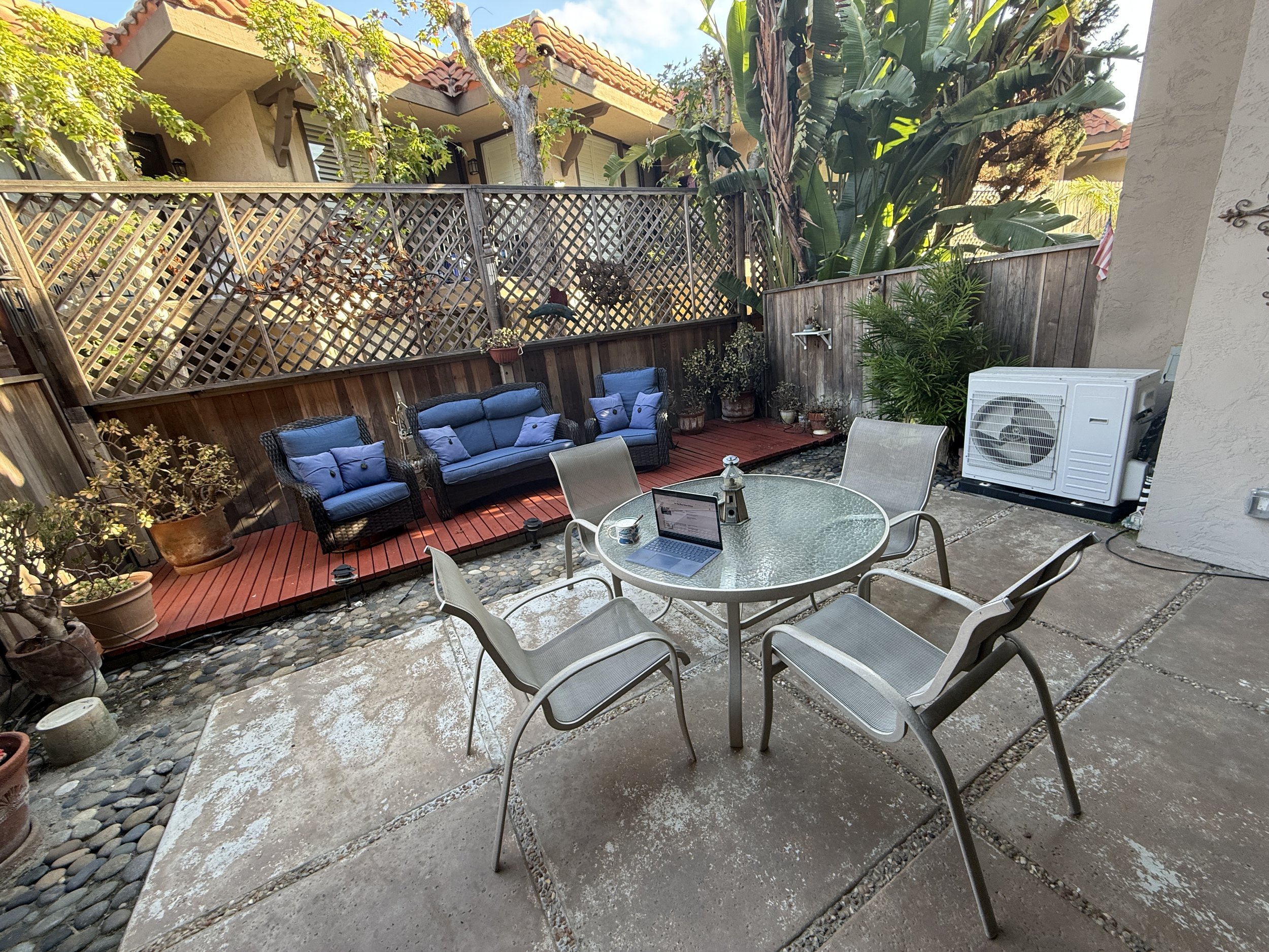 Working from the outdoor patio off the living room at our Solana Beach vacation rental—perfect place for coffee or getting in the "flow" before the tide goes down. 