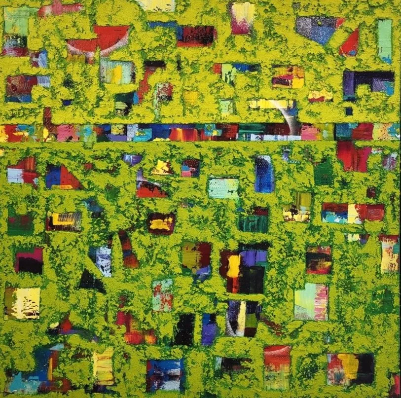 Abstract digital artwork with a green leafy overlay, showing multicolored geometric shapes and blocks underneath.