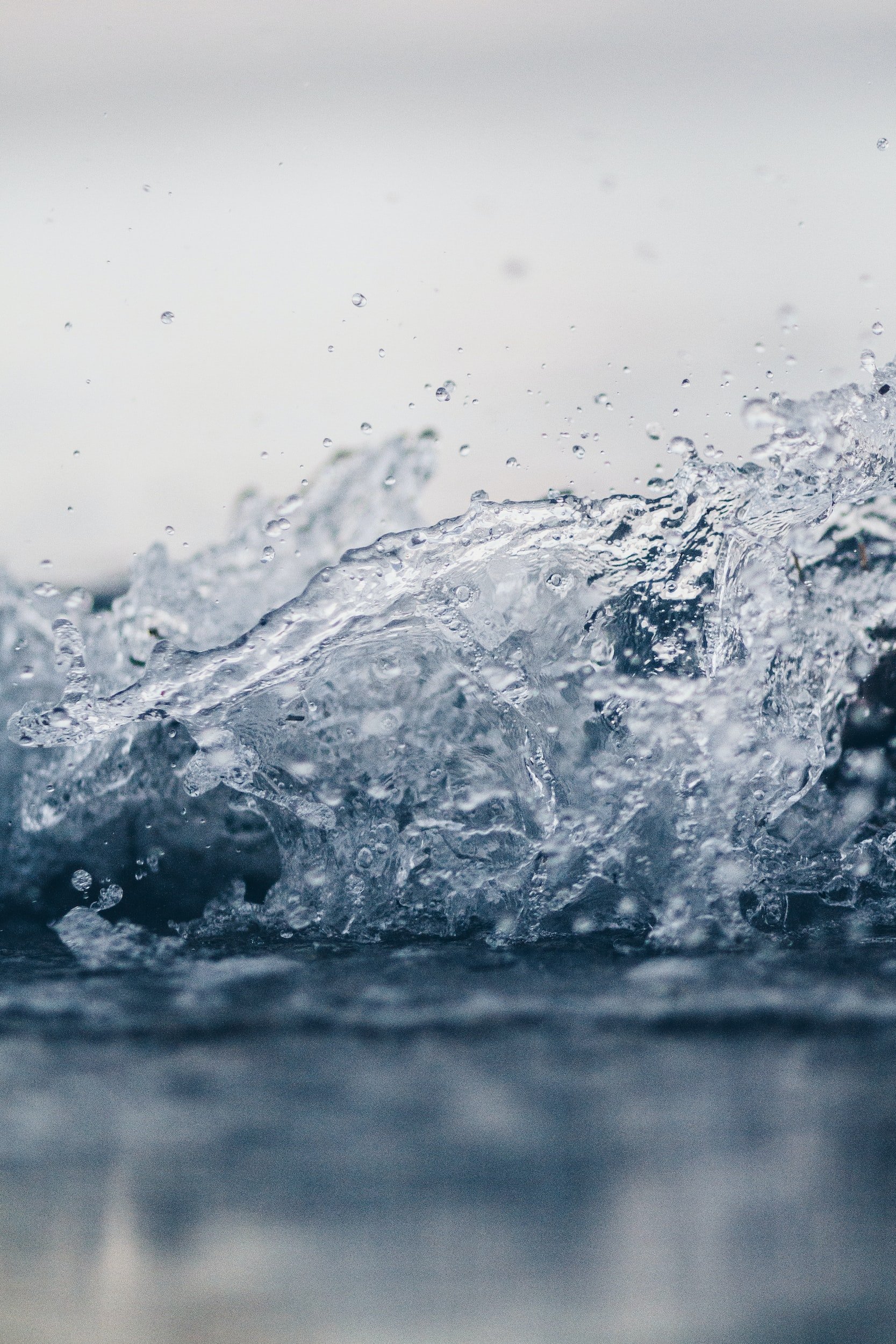 Close-up of water splashing with droplets in motion, capturing fluid movement and texture.