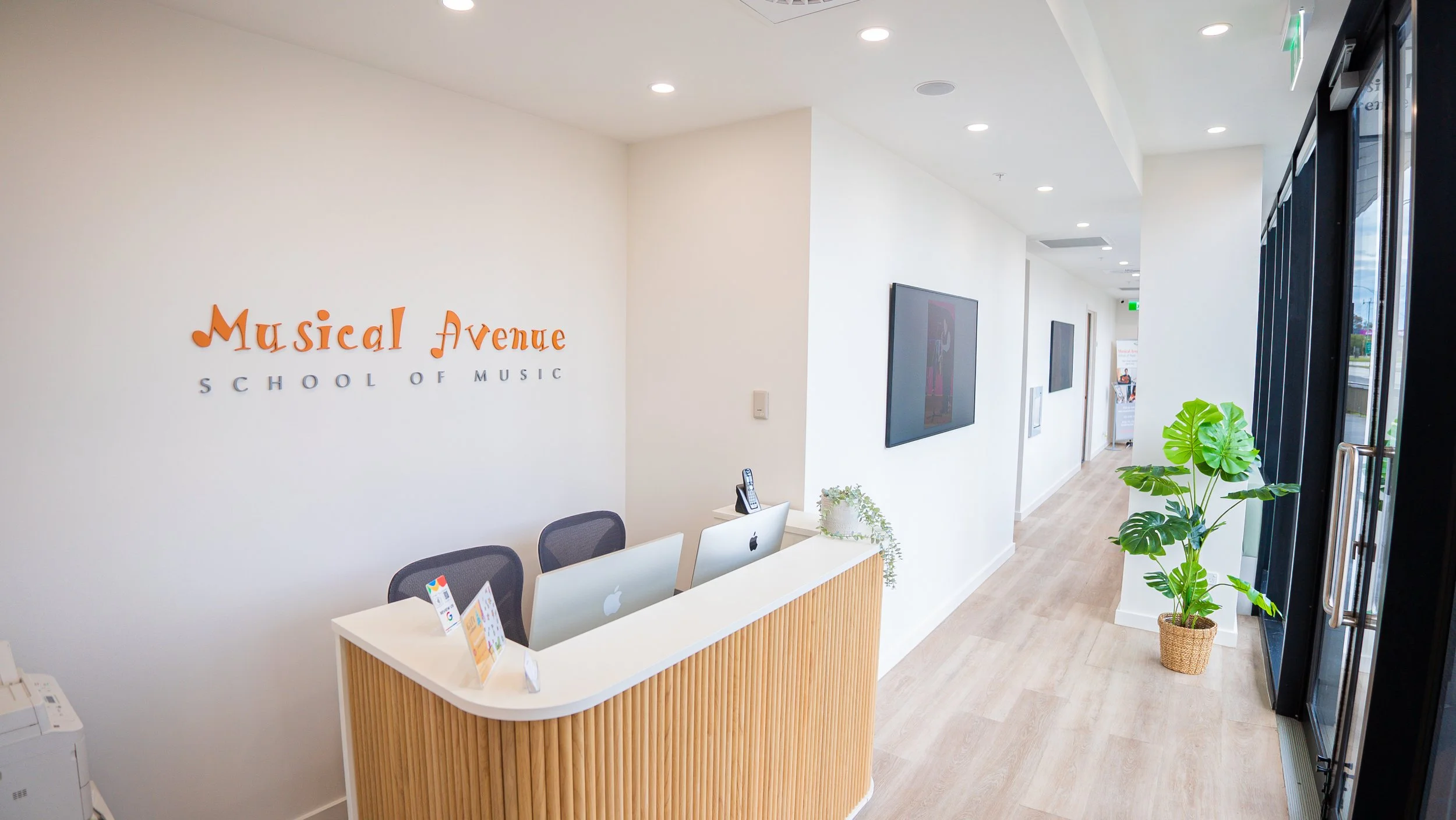 Reception area in a Music School with a front desk and computer.