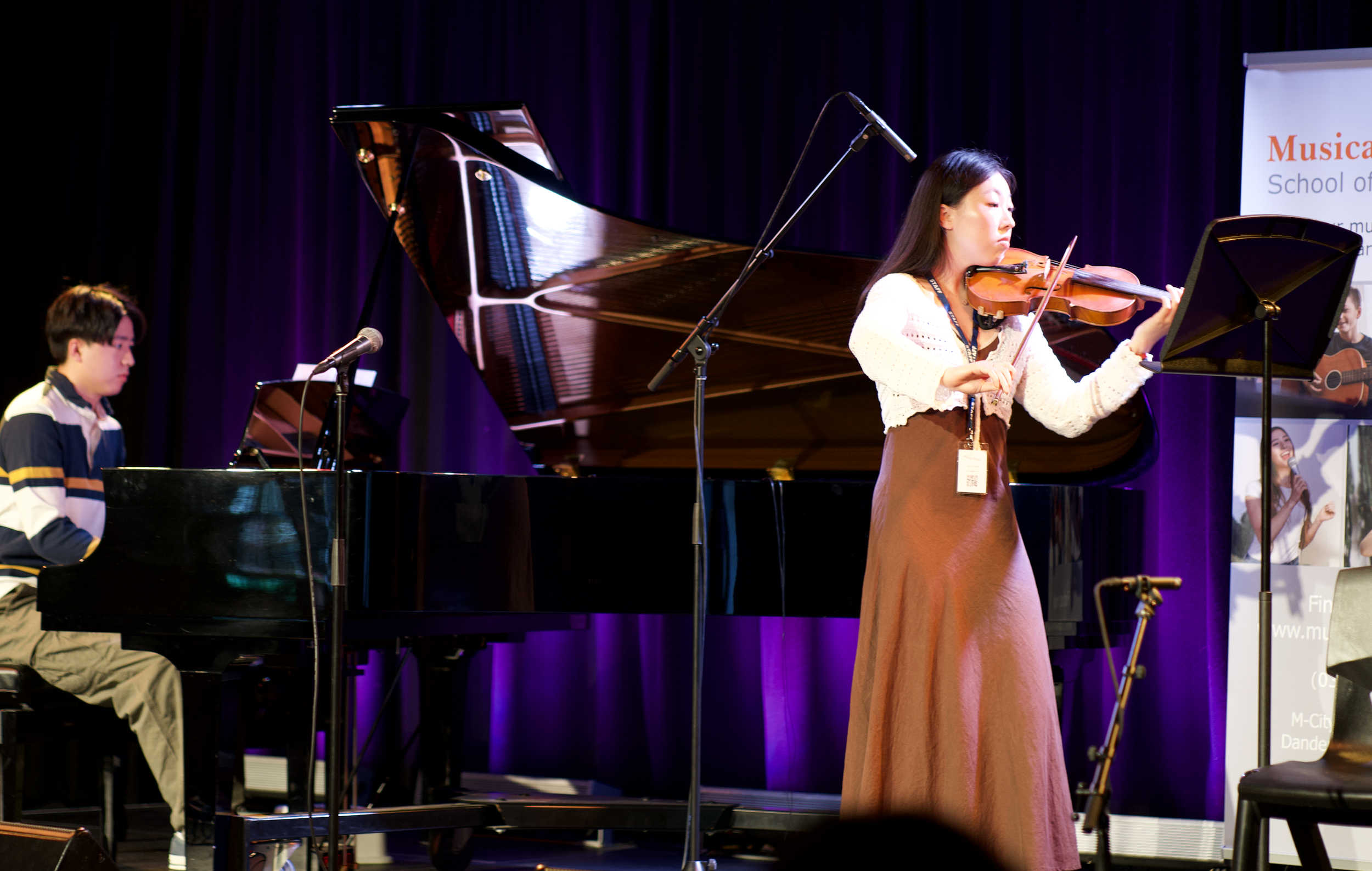 Piano and Violin teacher performing.png