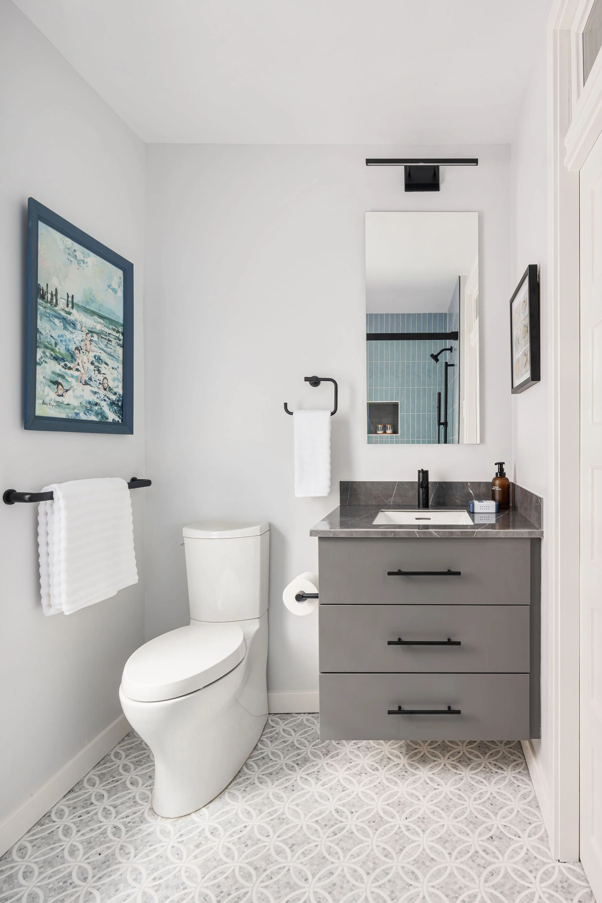 Clean modern hall bath with floating vanity
