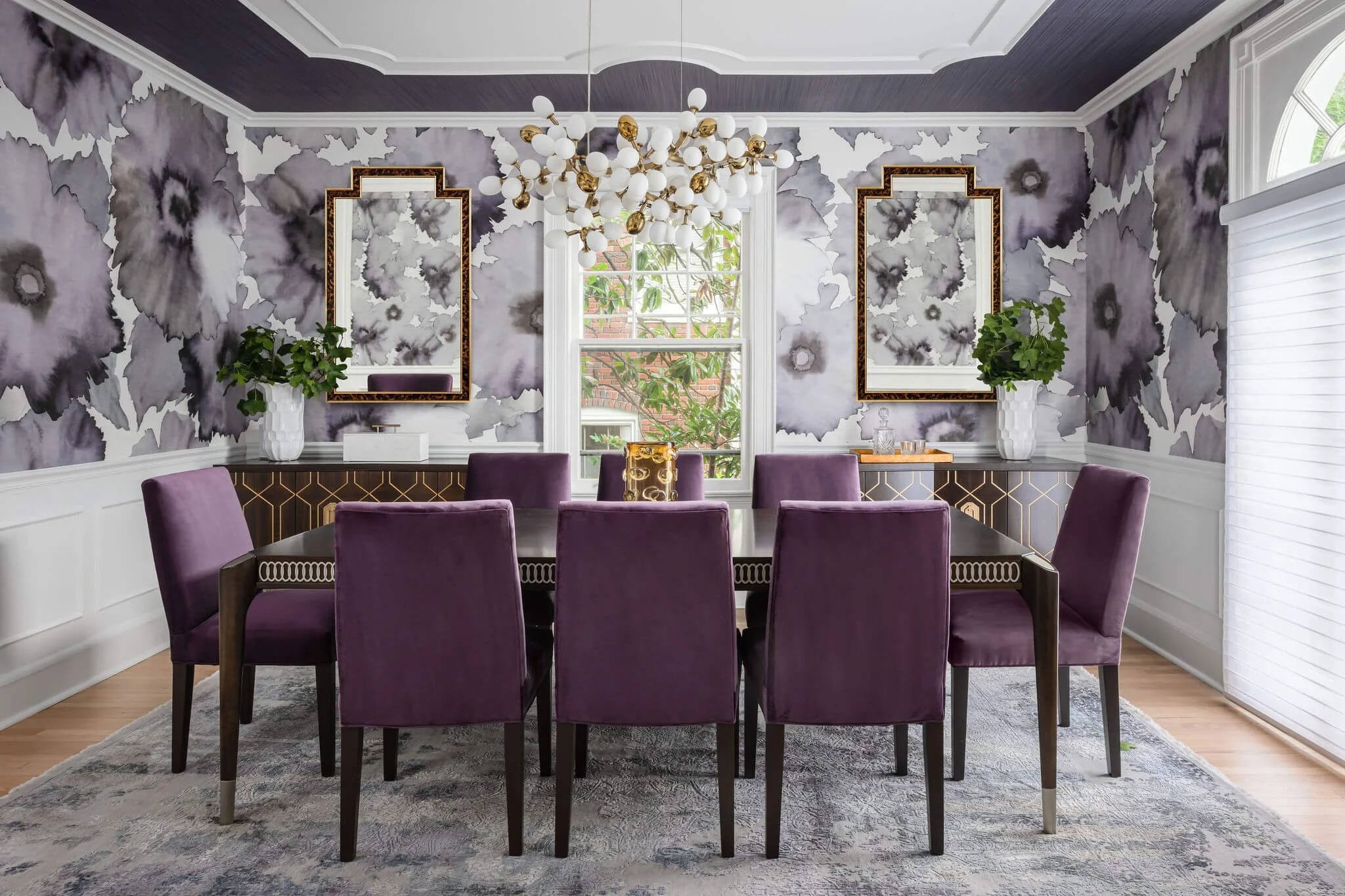 Dramatic dining room with floral wallcovering