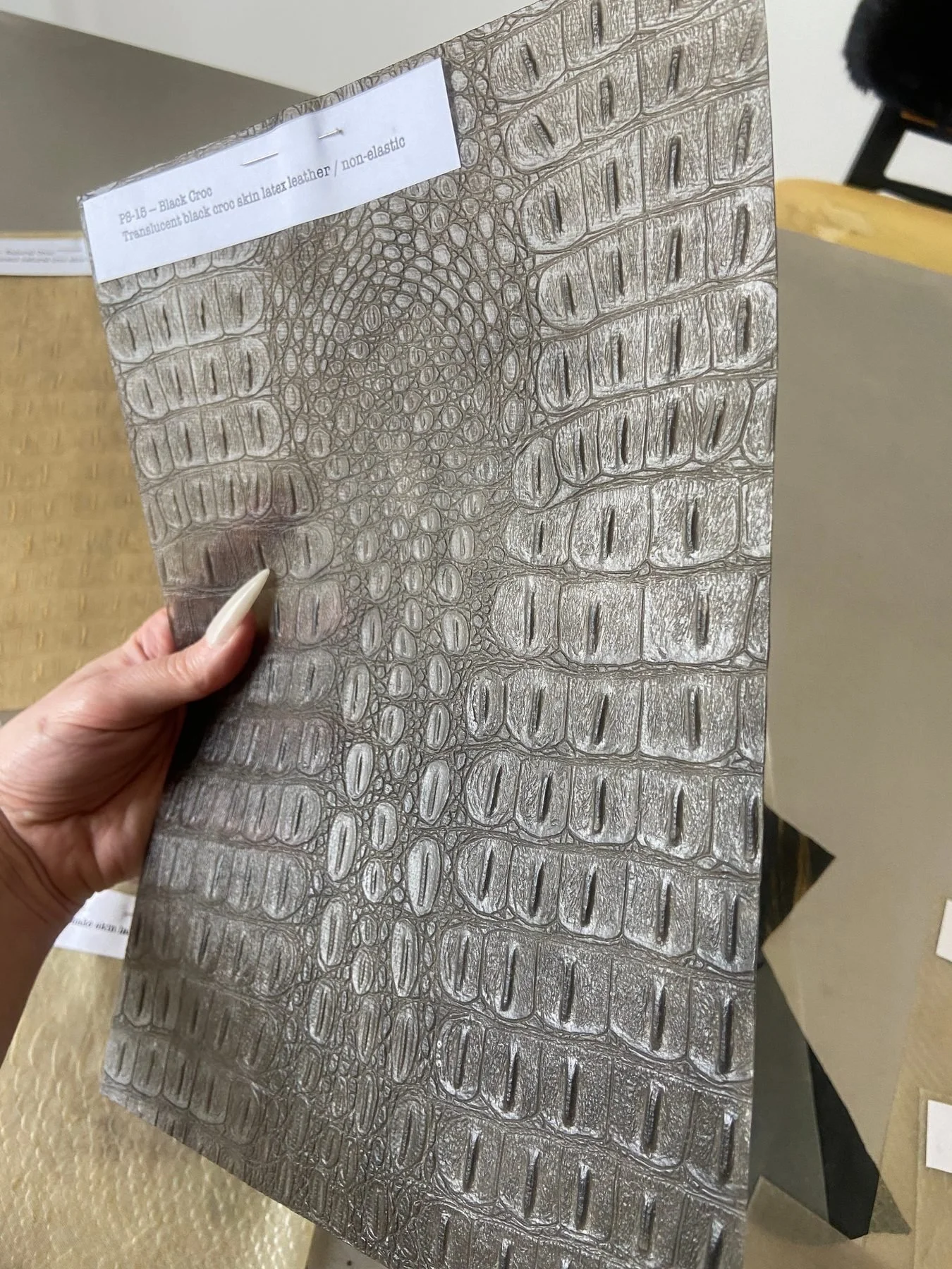 Translucent grey croc latex leather material sample developed from natural liquid latex by Janine Grosche / PATH