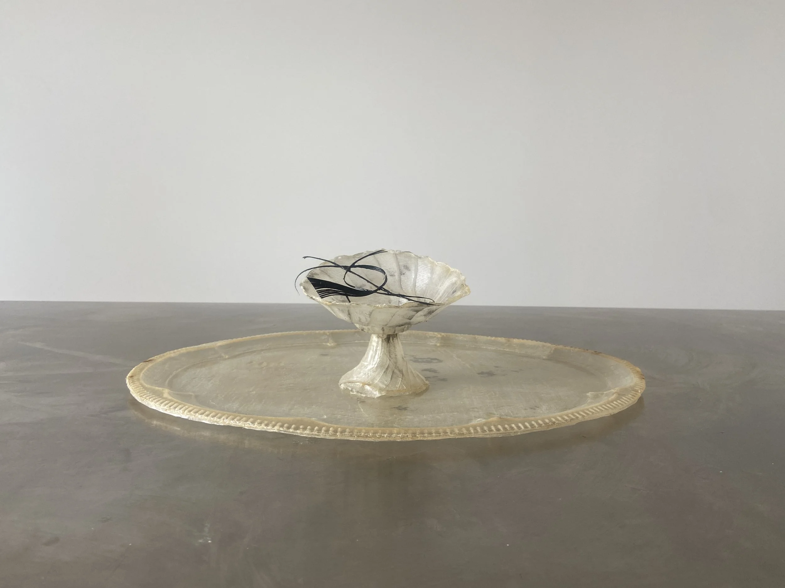 Vessel I from OMEN by Janine Grosche, a translucent vessel and tray sculpture handcrafted from natural liquid latex.