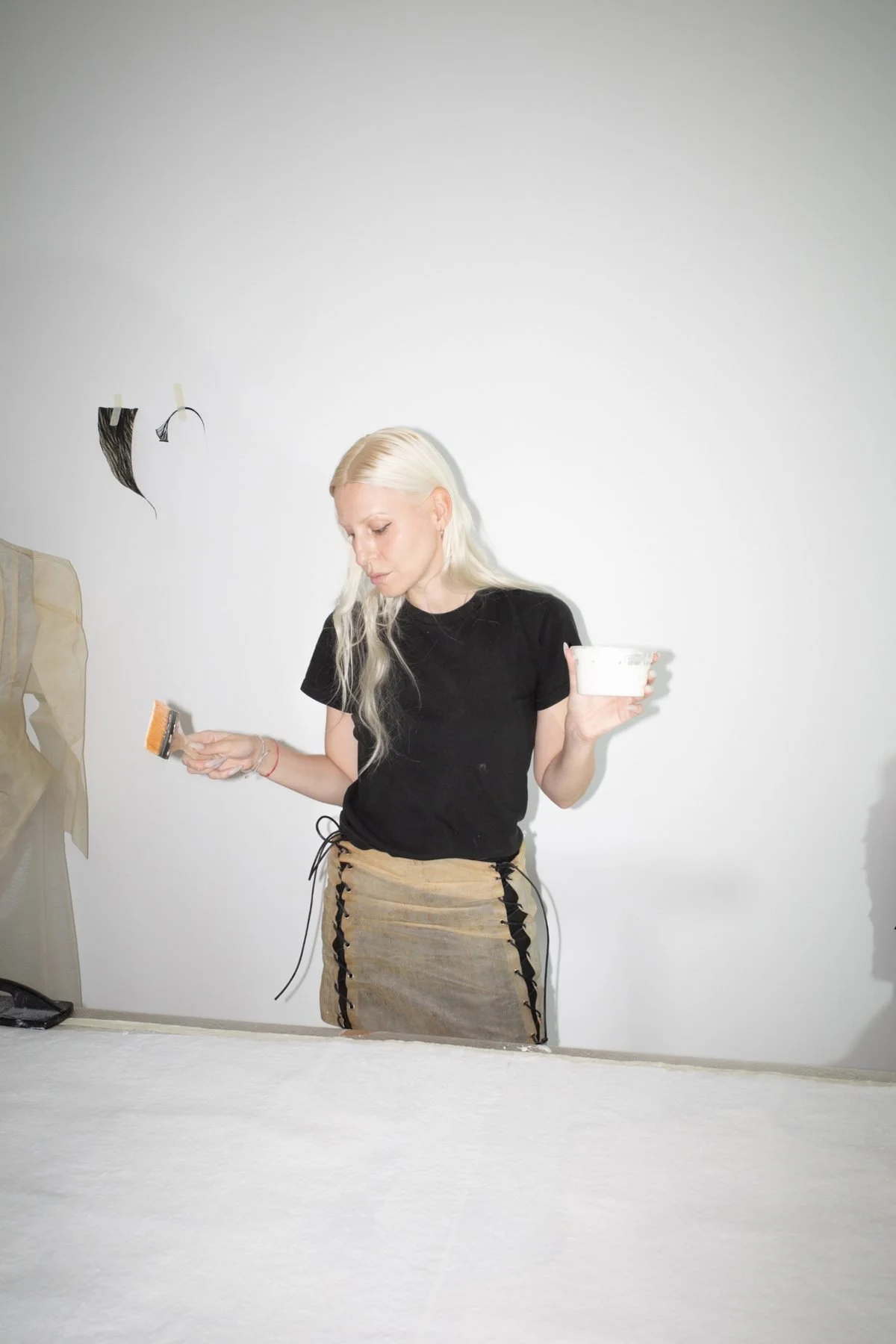 Janine Grosche working with natural liquid latex during material research and development in the PATH studio