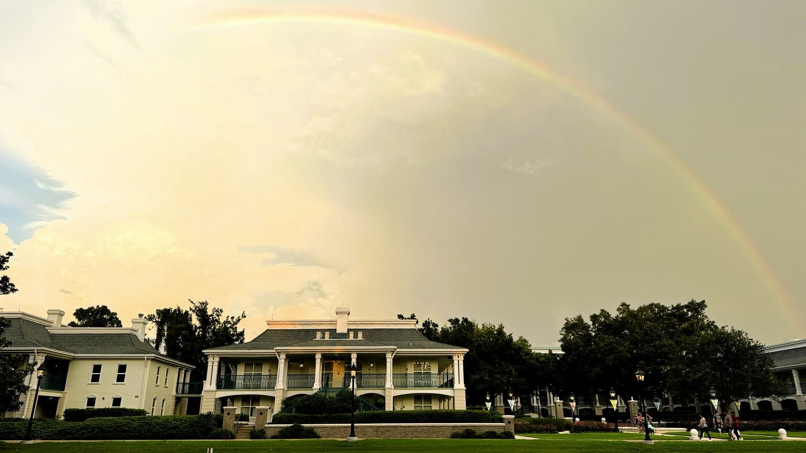 A rainbow shines over the plantation-style mansions at Port Orleans Riverside, a moderate resort in Disney World.