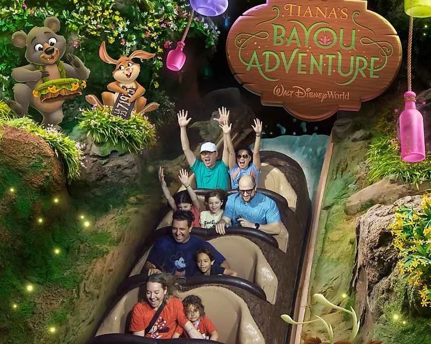 This is the Disney offered ride shot of Tiana's bayou adventure. Guests are going to down the final drop in various states of shock and joy. Disney has added cartoon adornments to the picture.