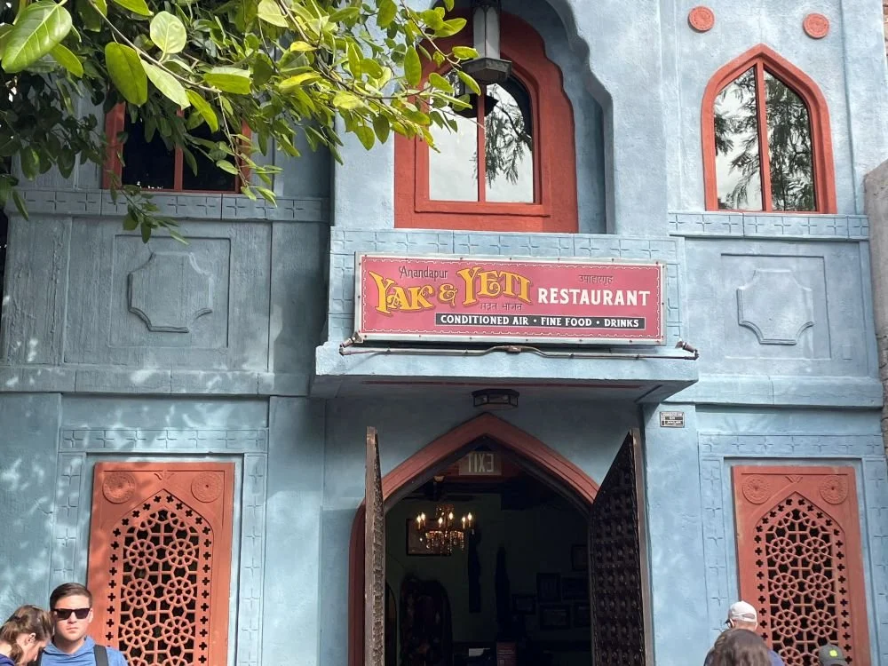 The entrance at yak and yeti in Animal Kingdom at Disney World. It has a stone, Himalayan themed-facade.