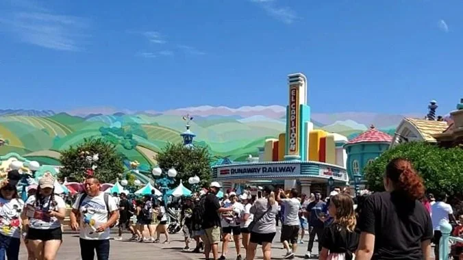 Mickey's Toontown in Disneyland California in Anaheim. You can see a whimsical, cartoon landscape and a cartoon version of the hyperion theater that houses mickey and minnie's runaway railway.