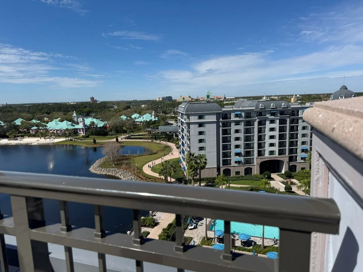 A picture from the balcony of Topolino's Terrace. You can see other parts of Disney's Riviera Resort in the foreground. In the distance you can see Tower of Terror at Hollywood Studios and the Swan and Dolphin resort.