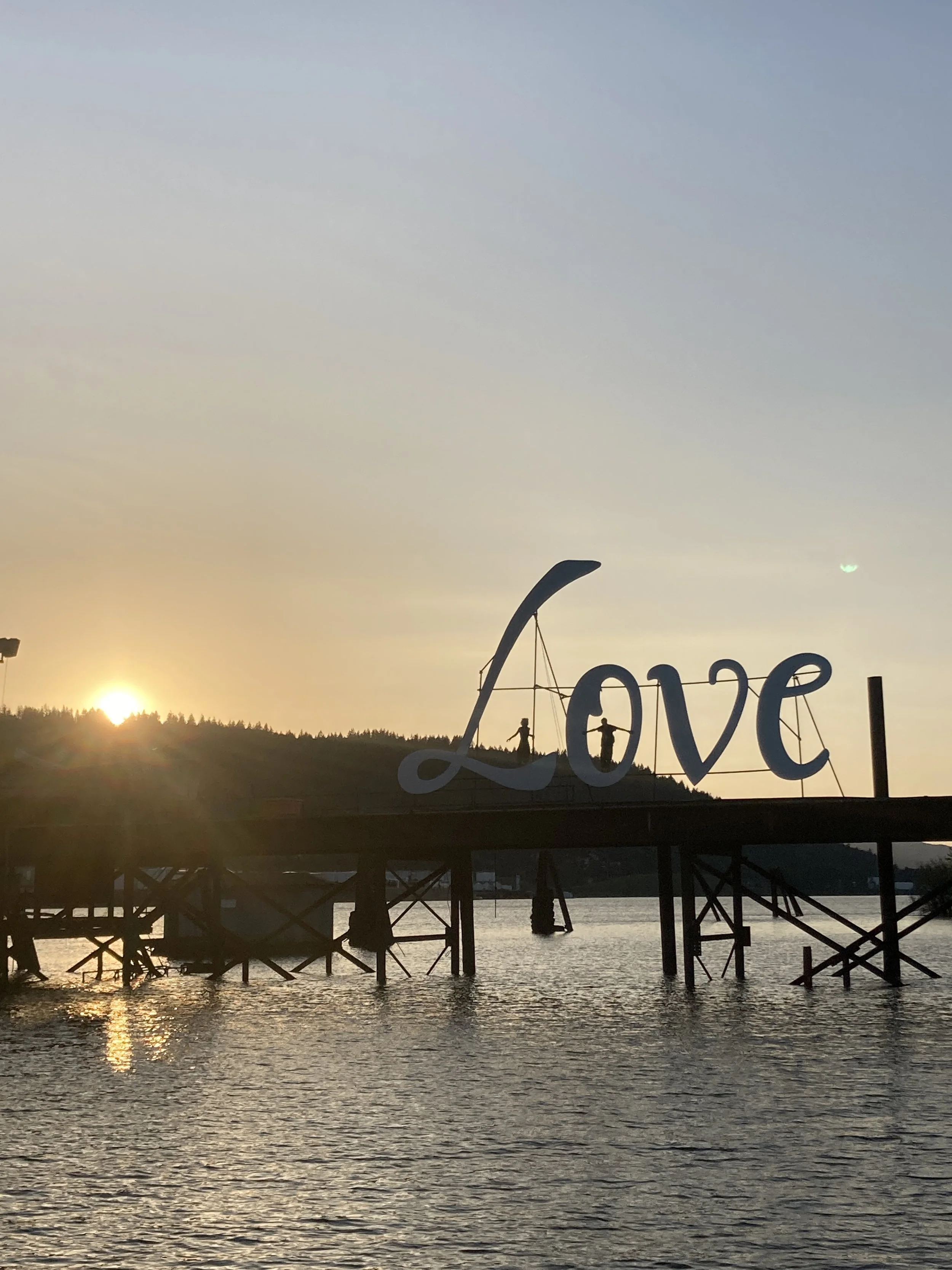 A photograph of the "Love" sign at the Fleet HQ at sunset