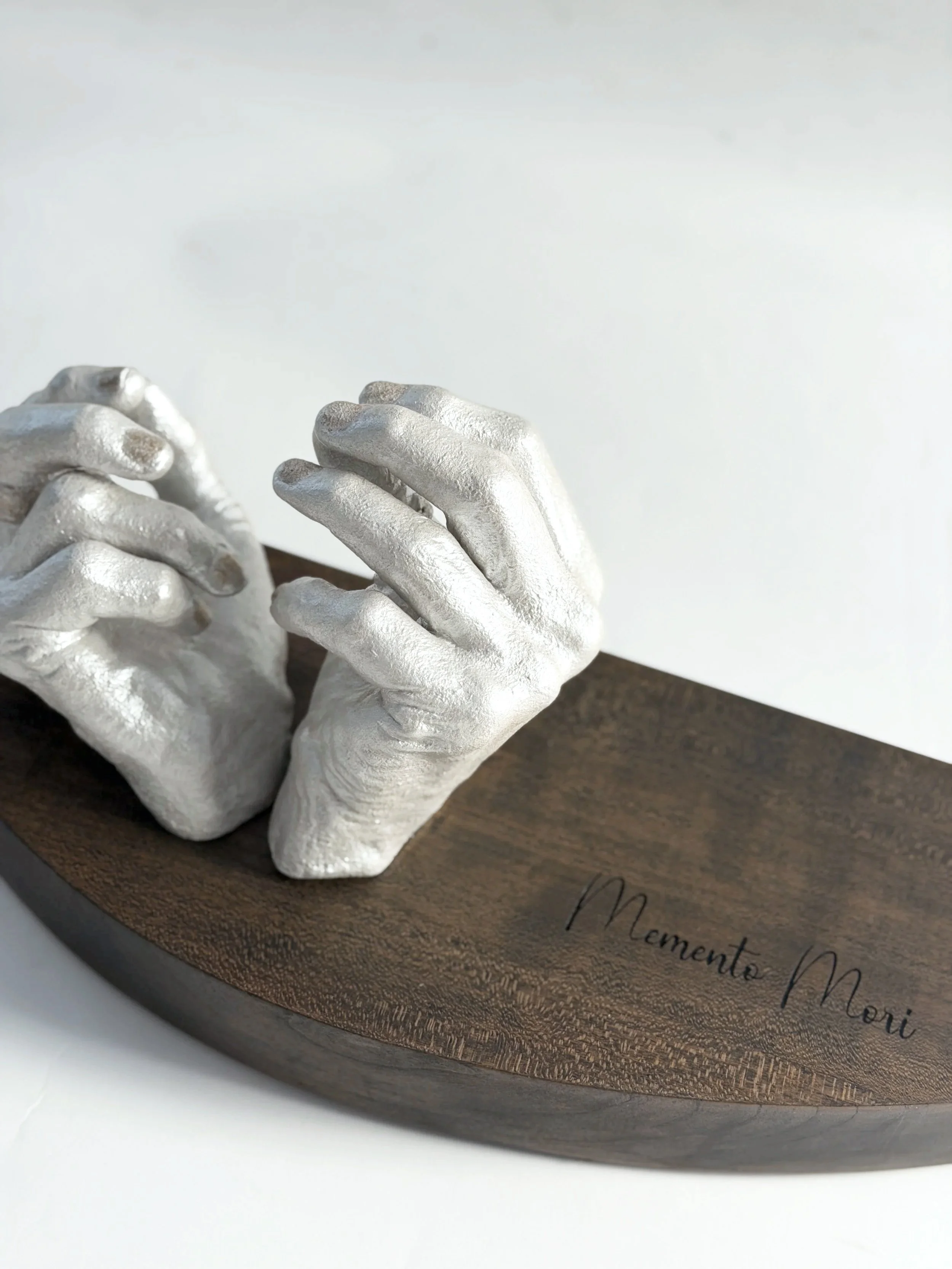 “Memento Mori.”

A small monument to what aches, what fades, and what stays luminous.
Cast from the hands of a woman who has given her life to art—
and to the holy work of helping women feel whole again.

She’s wrestled her own body, too:
rheumatoid 