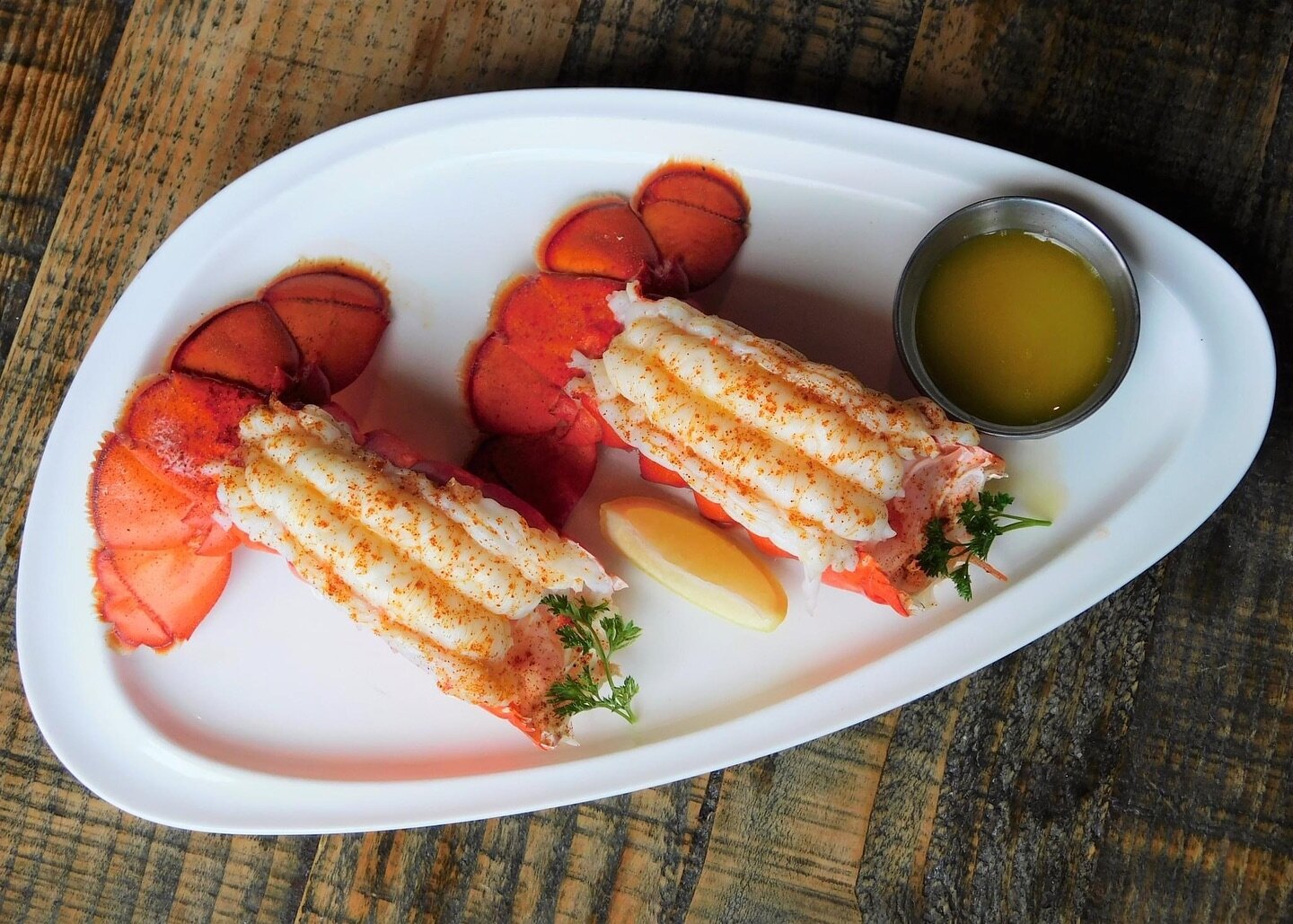 Cold Water Lobster Tails 🦞 Now available on our Dinner Menu! 

A pair of seasoned and grilled 4-5 ounce cold-water lobster tails. Served with hot drawn butter. Or choose three tails! Served with your choice of salad or side.