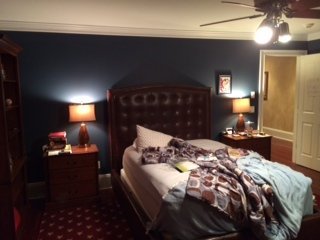 existing boys bedroom with navy walls before home makeover
