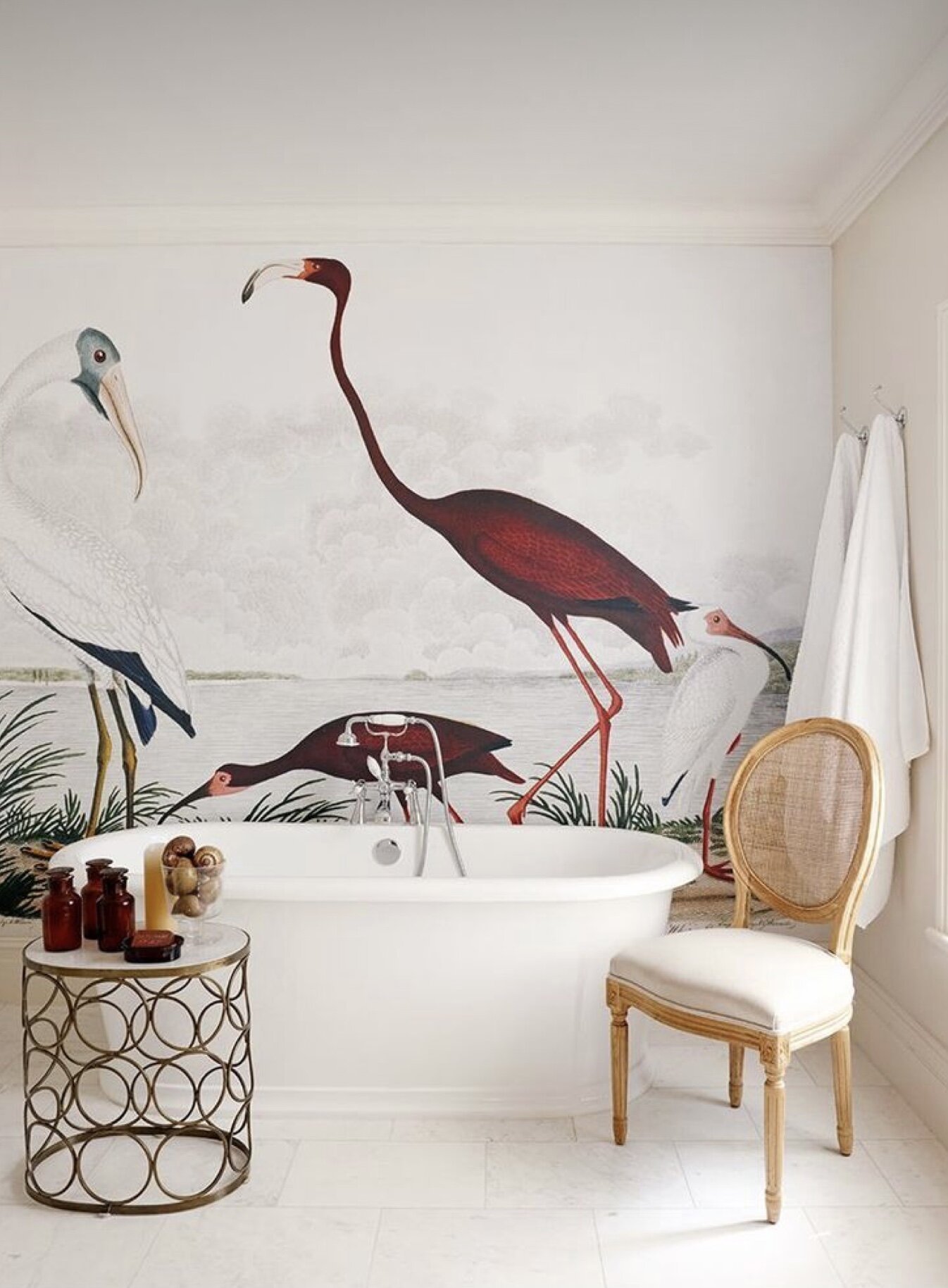 bathroom design with crane wallpaper  behind freestanding tub