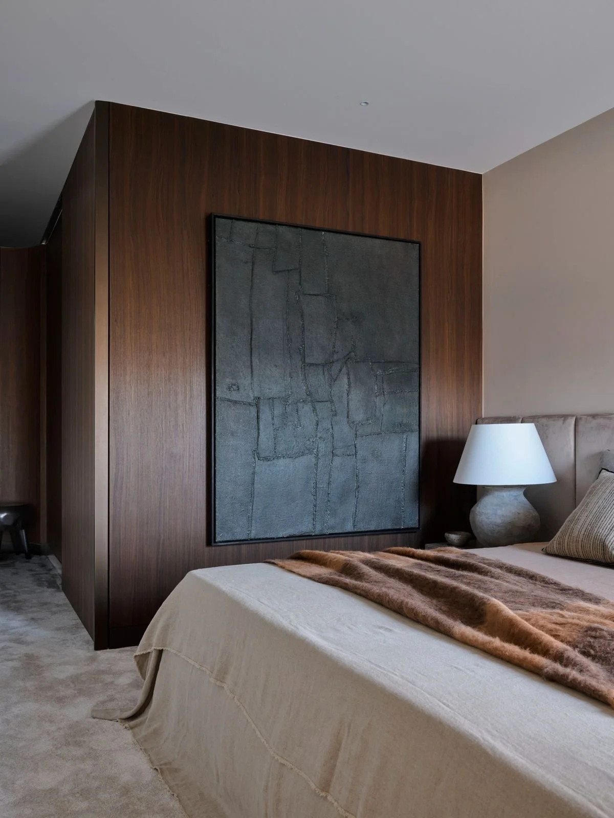 Minimalist Luxury Master Bedroom with Wood Paneling