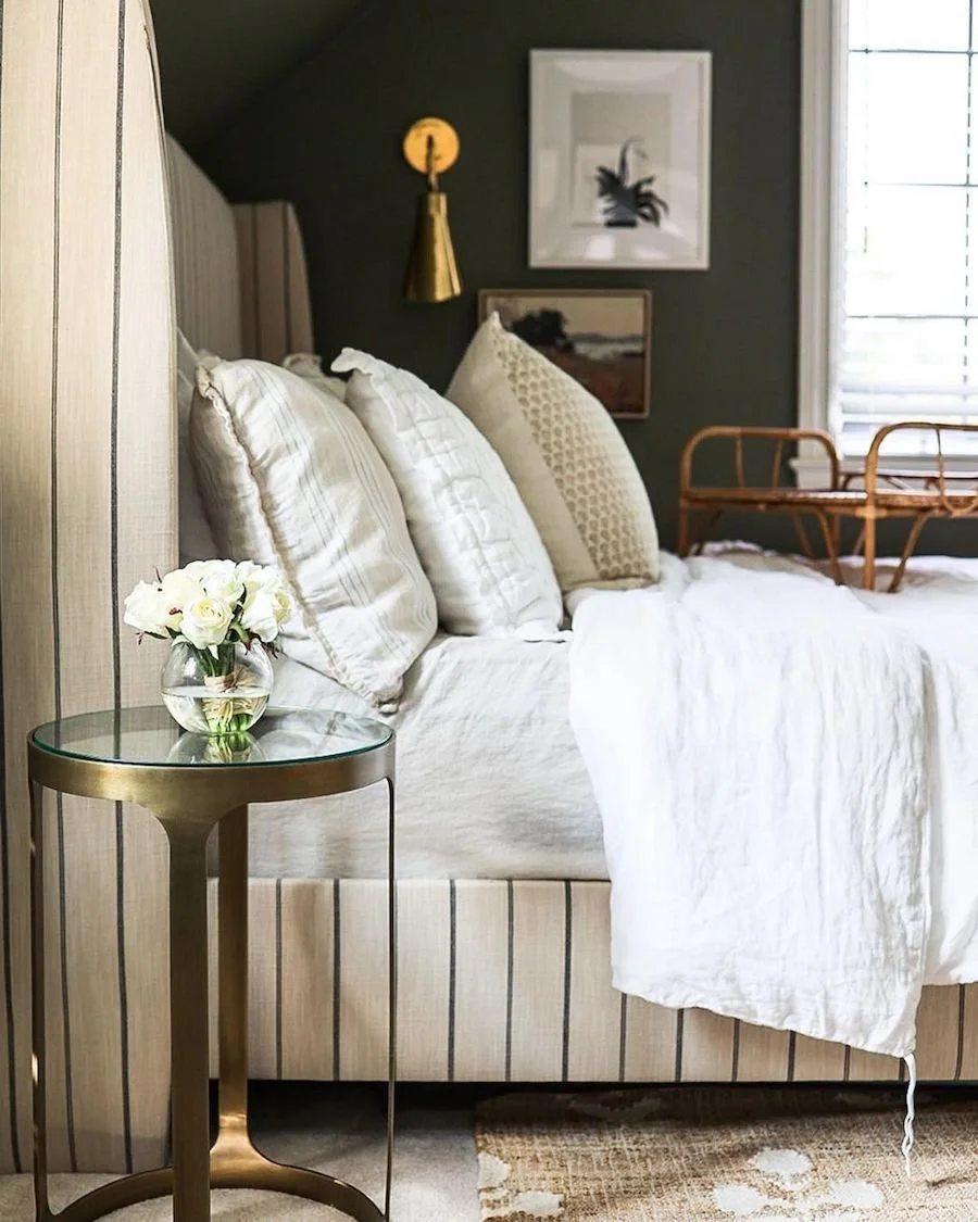 Layered Luxury Bedding with Brass Accent Table