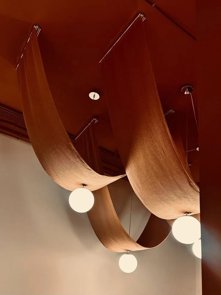 Luxury Draped Ceiling Design with Sculptural Pendant Lighting