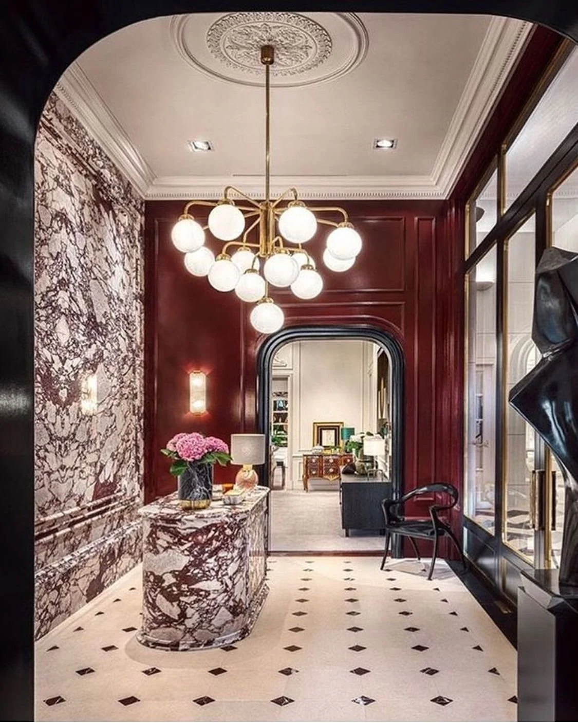 Luxury Marble Bar with Statement Chandelier and Classic Molding