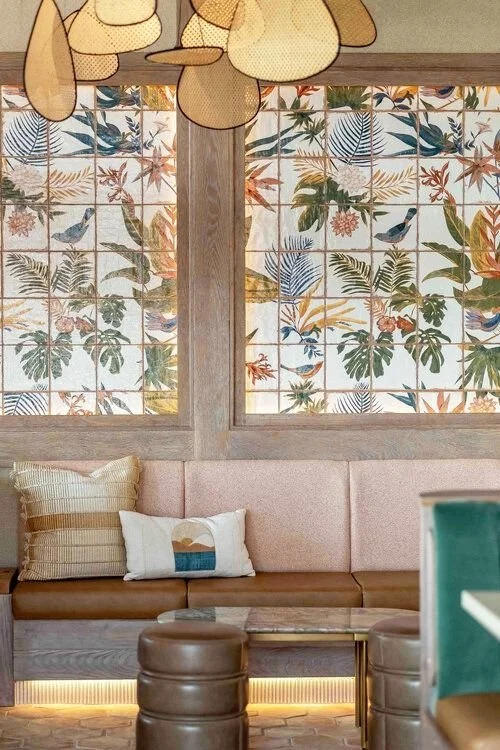 Floral Wall Tile and Banquette Seating Area