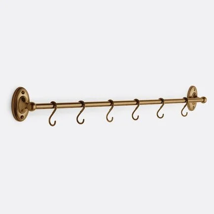 Antique brass wall-mounted kitchen rail with six removable S-hooks and decorative round brackets, ideal for hanging utensils, cookware, or towels.