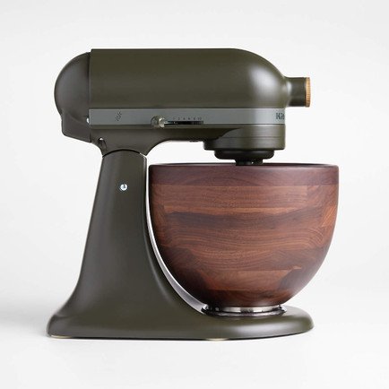 Dark olive green stand mixer with a handcrafted walnut wood mixing bowl, photographed against a clean white background.