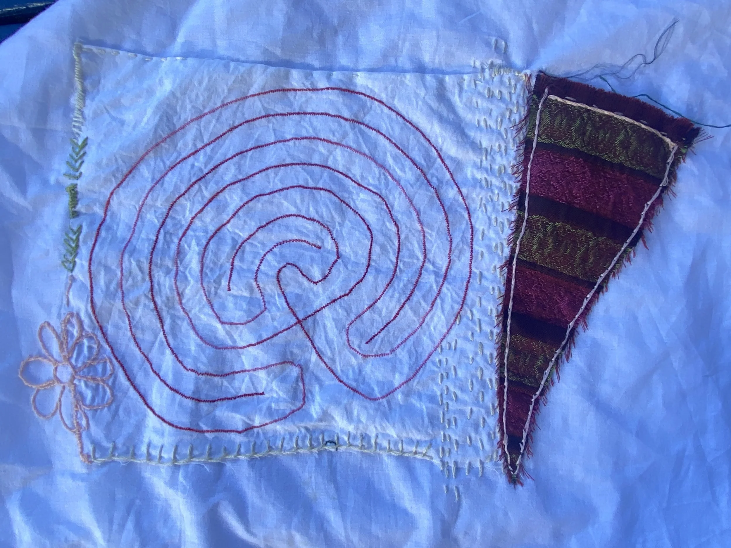 Sewn labyrinth on fabric, picture taken by Anne-Marie chmielewski