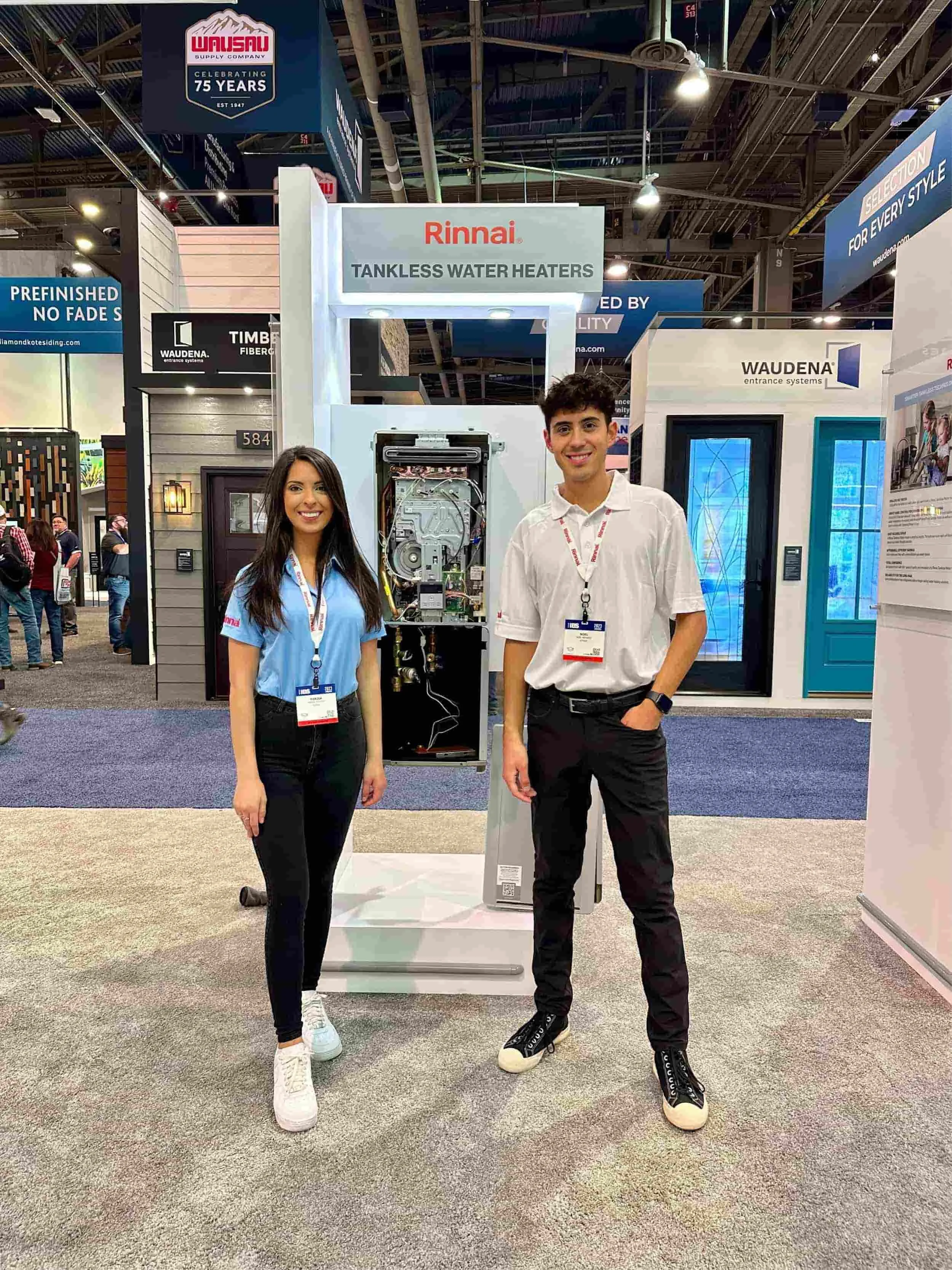 Two people at an event for Rinnai