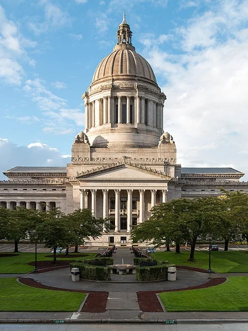 The capital building in Washington D.C. with blue sky behind.