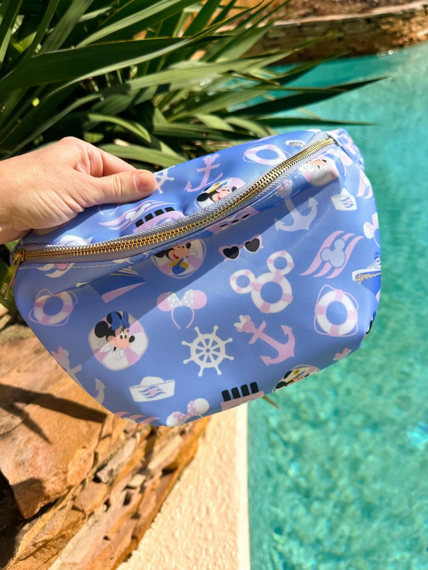 Disney cruise, but make it pink! This light blue and pink version of our best selling fanny pack is now available! (Plus several other printed fanny packs, patches, tees and pajamas!) Shop now! 🩷🩵