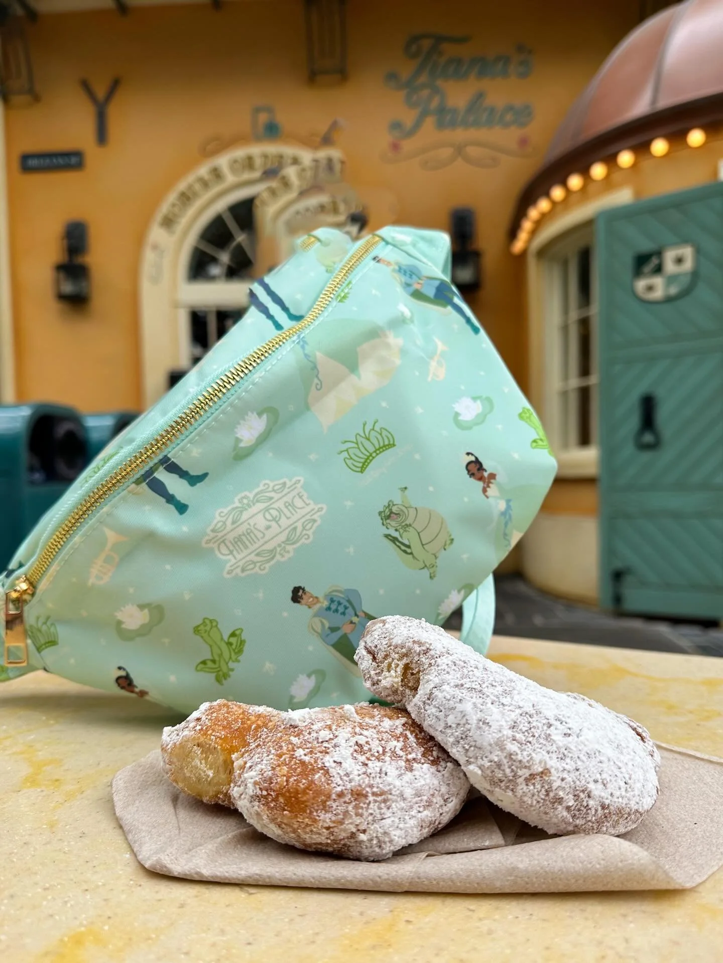 Oh how I wish I had some beignets today! This Tiana bag is so perfect for Spring princess outfits and Magic Kingdom trips. available now on our website.