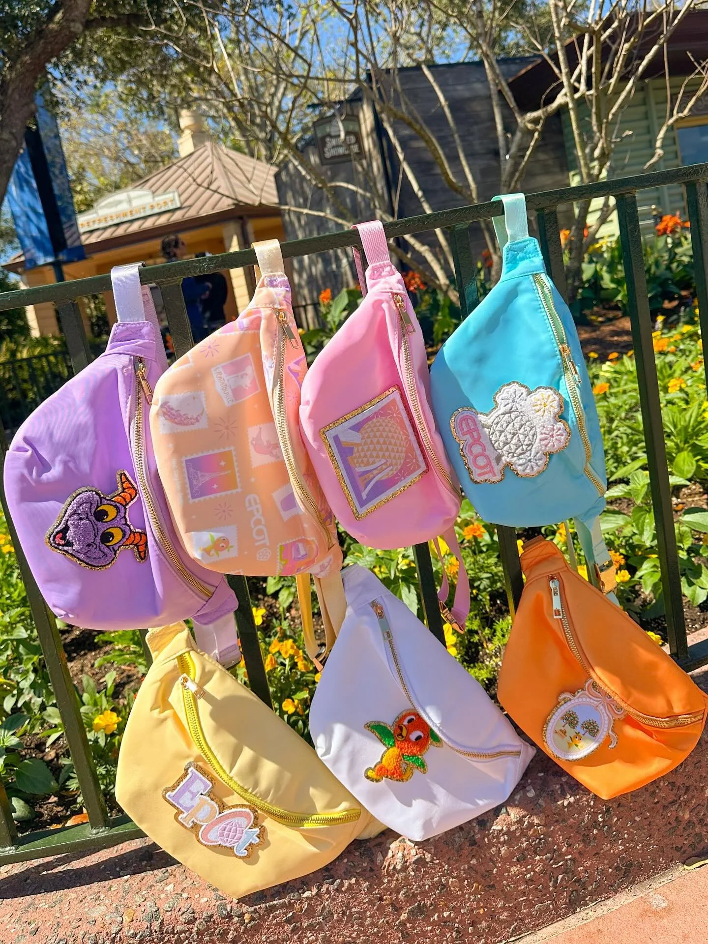 🌸✨🌼This new Epcot collection is now available on our website! New printed fanny pack, patches and a coordinating tee or crew to match. Shop now! This is so perfect for Epcot Flower and Garden trips coming up. 🌼✨🌸