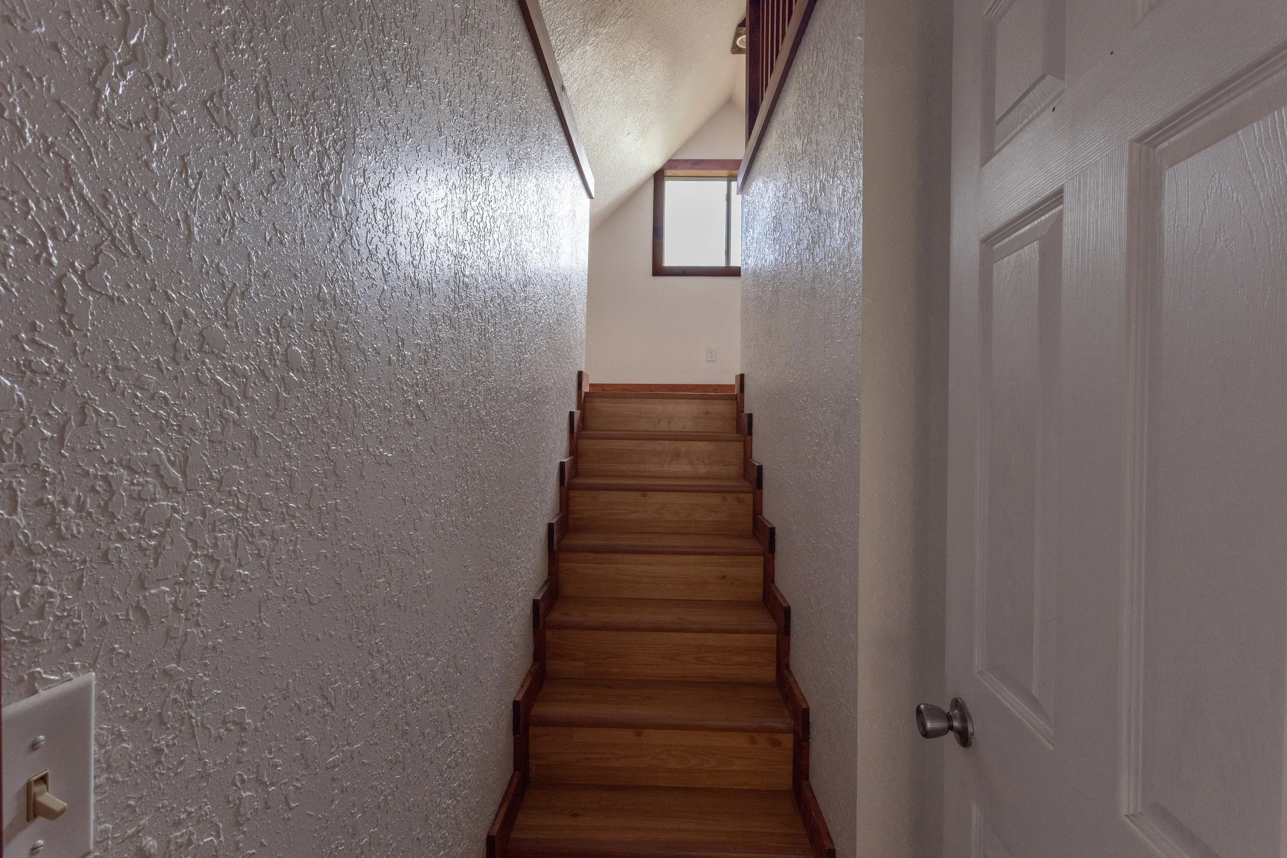 stairs leading up to a bedroom in a Lead SD apartment rental property
