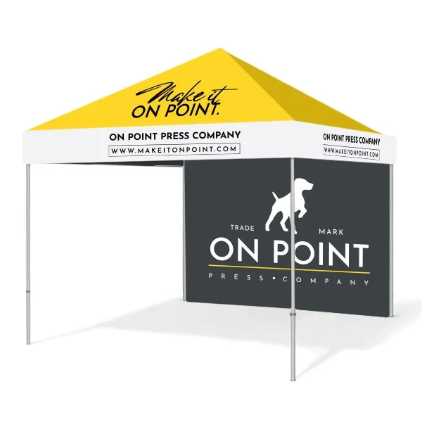Trade show booth with a black tablecloth display and a canopy tent featuring the On Point Press Company branding and slogan 'Make it on point'.