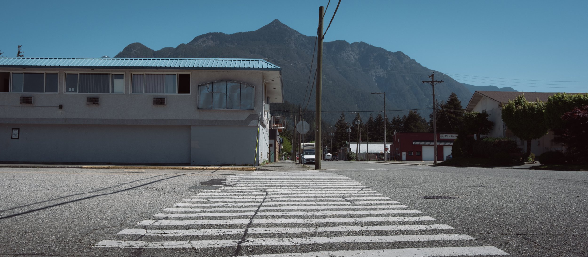 Blue sky, blue roof, white walls, white crosswalk. Simple. Light was harsh so I muted the colours, made it all look washed out.