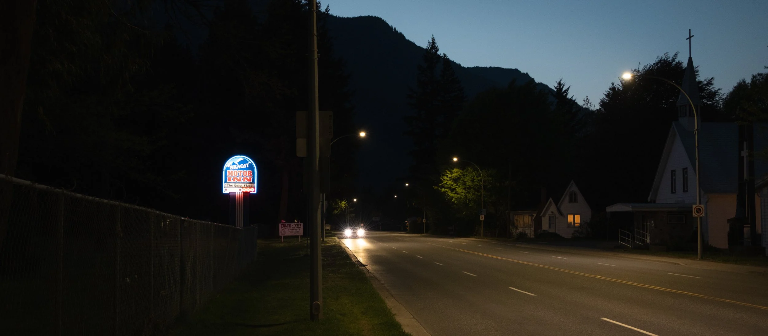 That neon sign caught my attention, and then there was that car coming. There's just something about this shot... It could be an intro to something. Some stranger rolling into town, and then things happen.