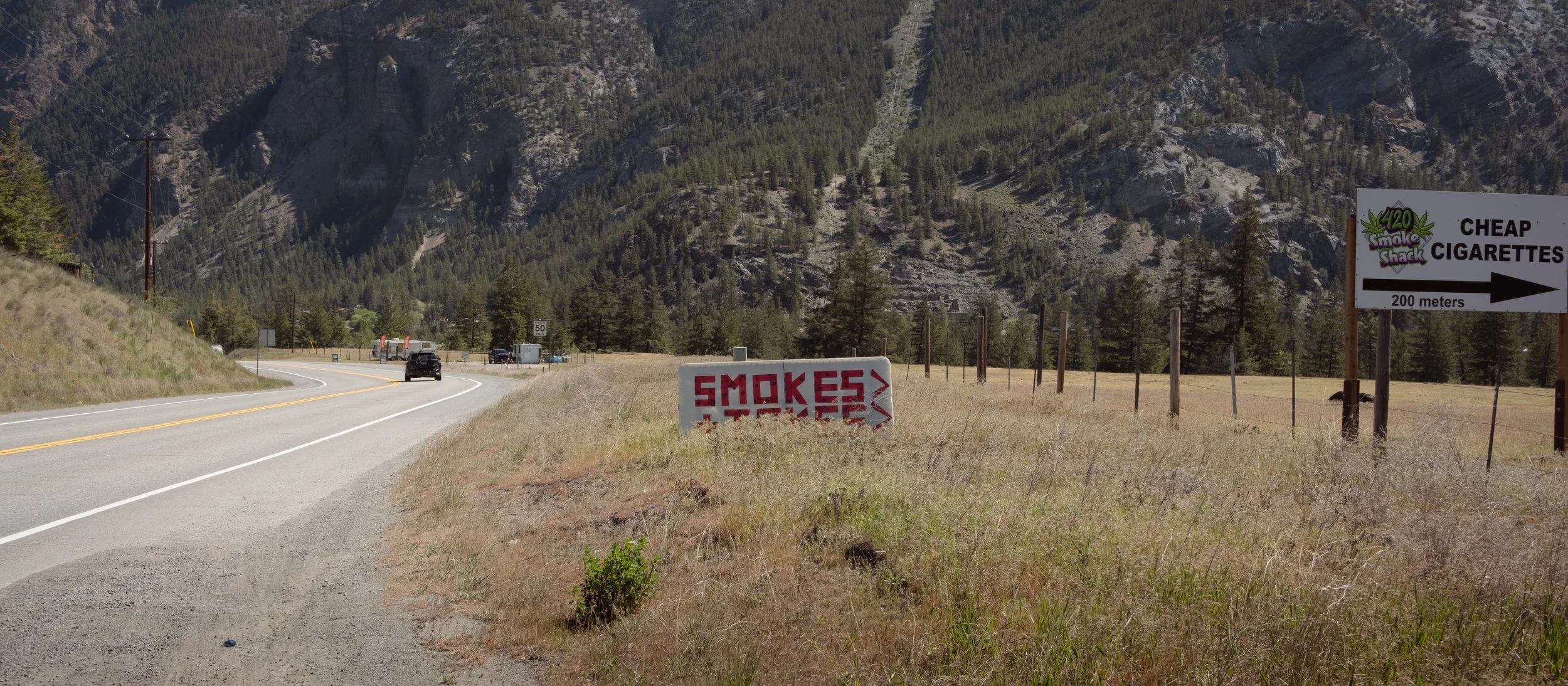 Makeshift road signs on the Crowsnest Highway, near Hedley