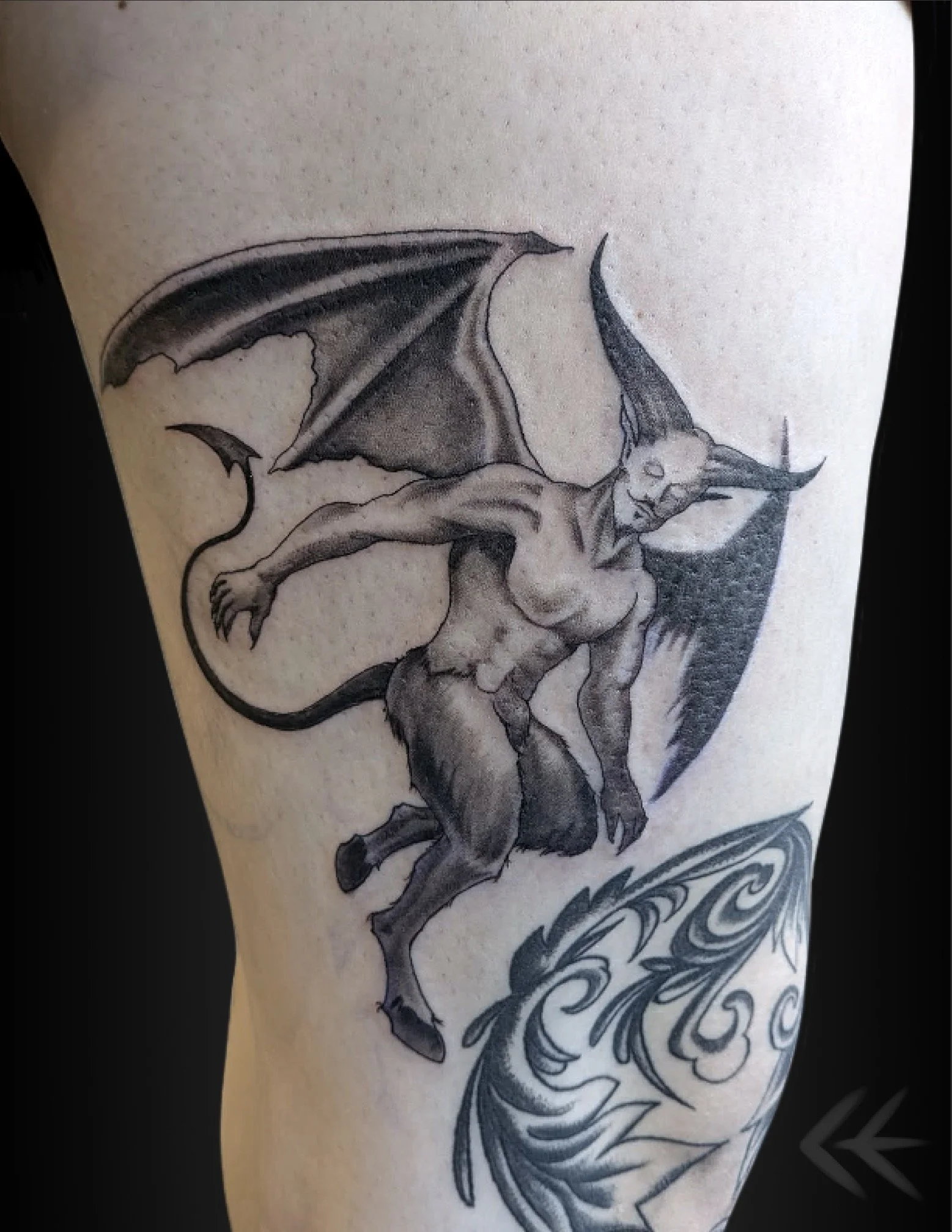Edmonton realistic black and grey realism devil tattoo artist.jpeg