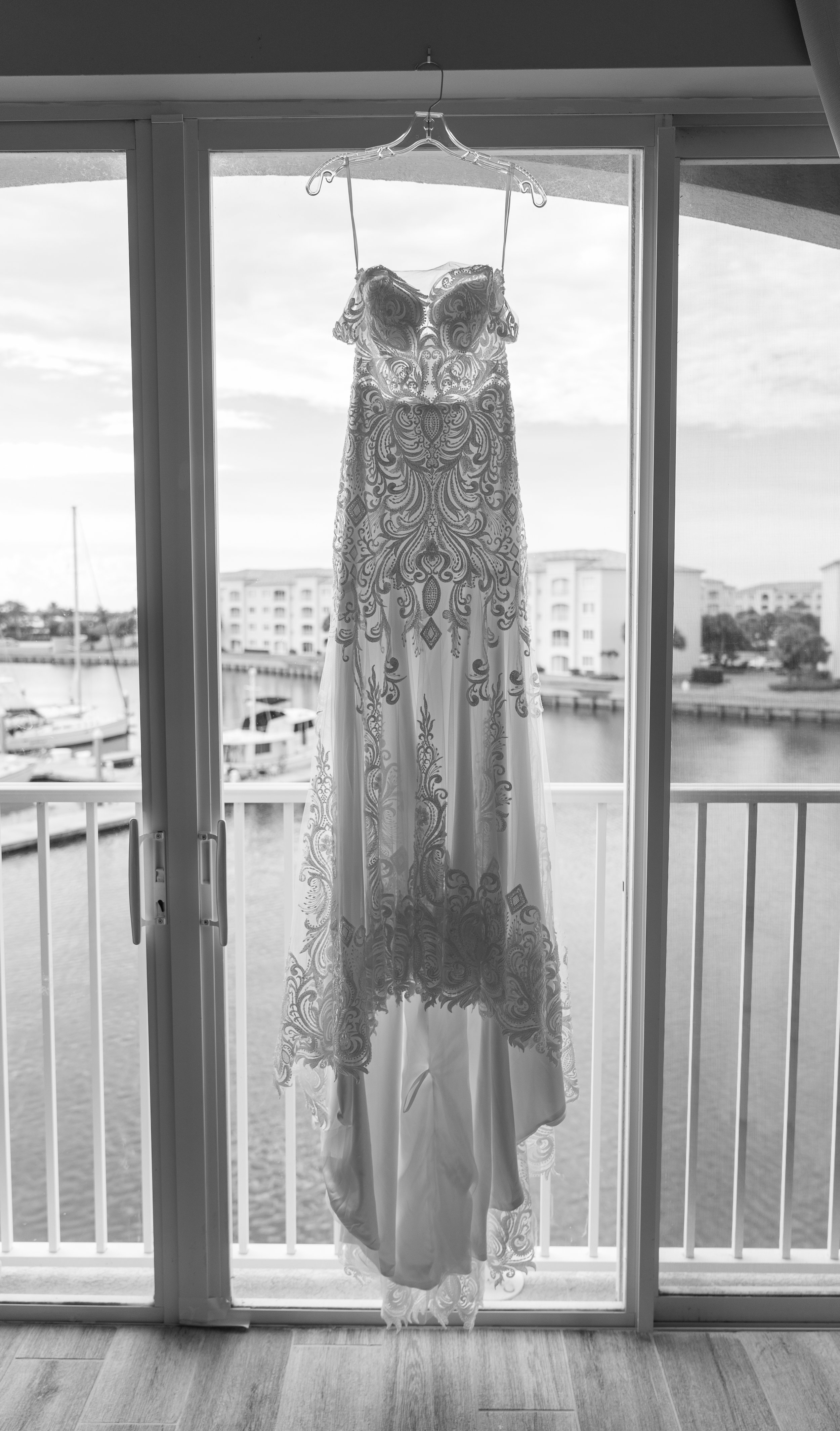 Her gown catches the morning light, waiting for the day to begin