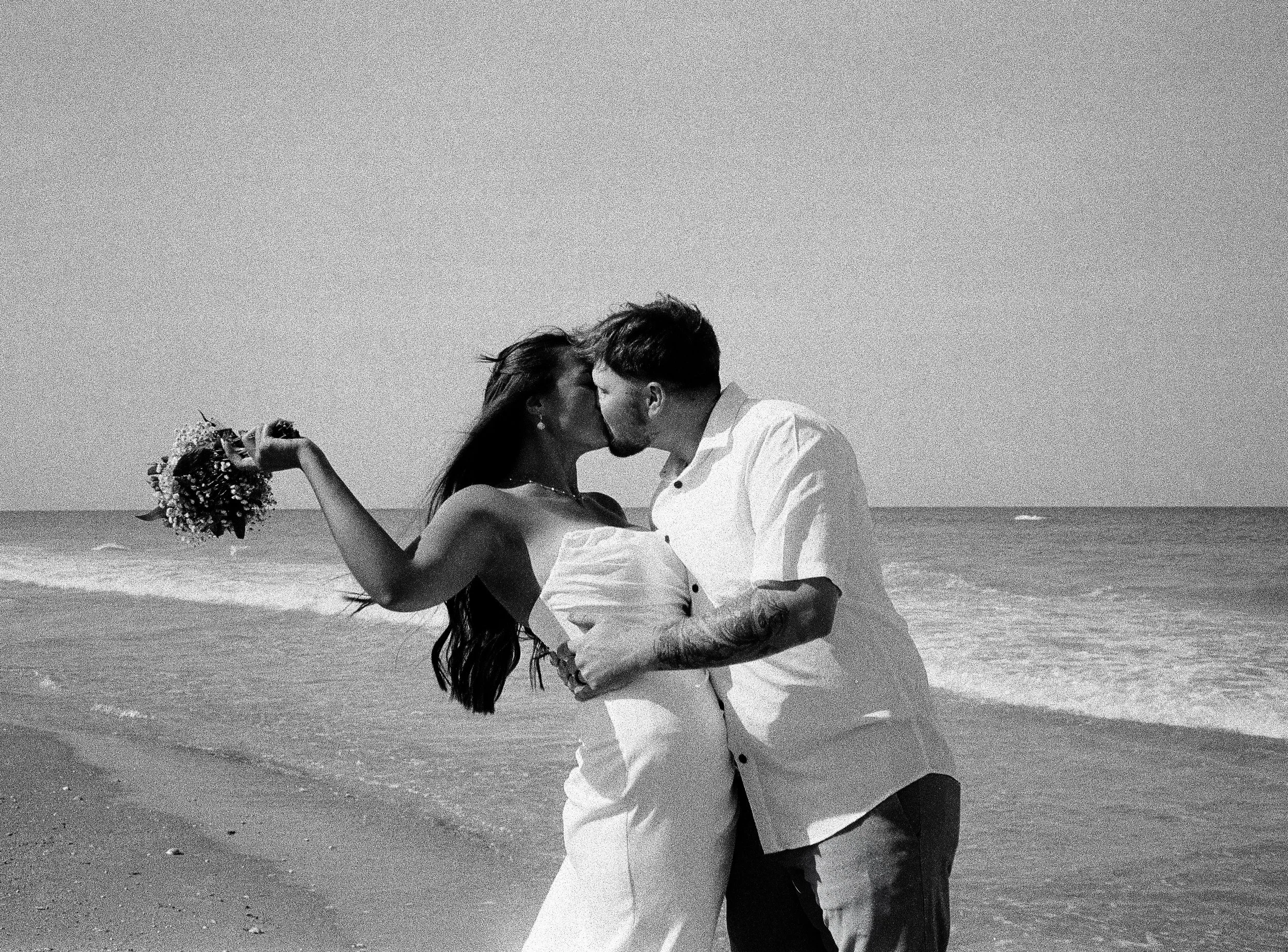 Black-and-white film photography  beach wedding portrait on Florida's Treasure Coast. 