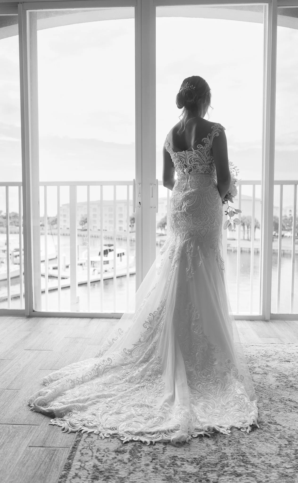Bride photographed in natrual window light before her wedding ceremony. 